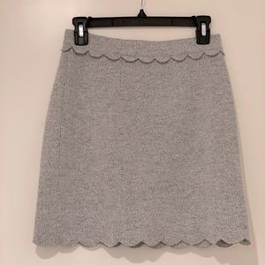 Club Monaco wool mini skirt with a peplum edge.
